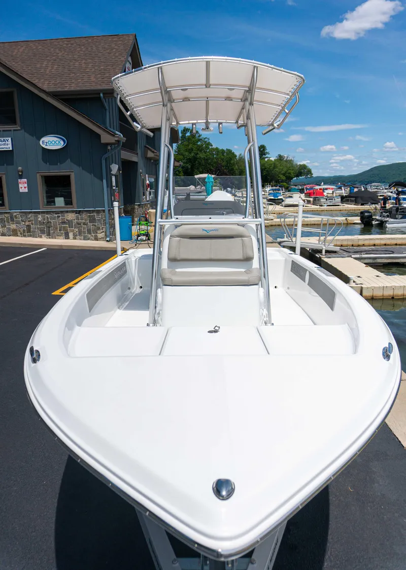 Slide: The Image of 2023 Savannah 190 IS boat docked at a marina on a sunny day. - 3