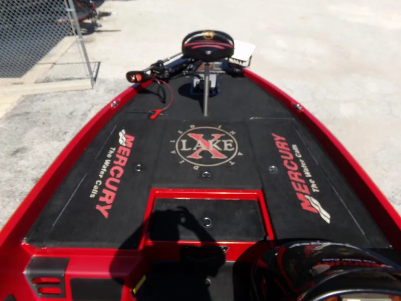 Slide: The Image of 2000 Ranger 518SVX Comanche boat deck with Mercury branding and "Lake X" logo. - 16