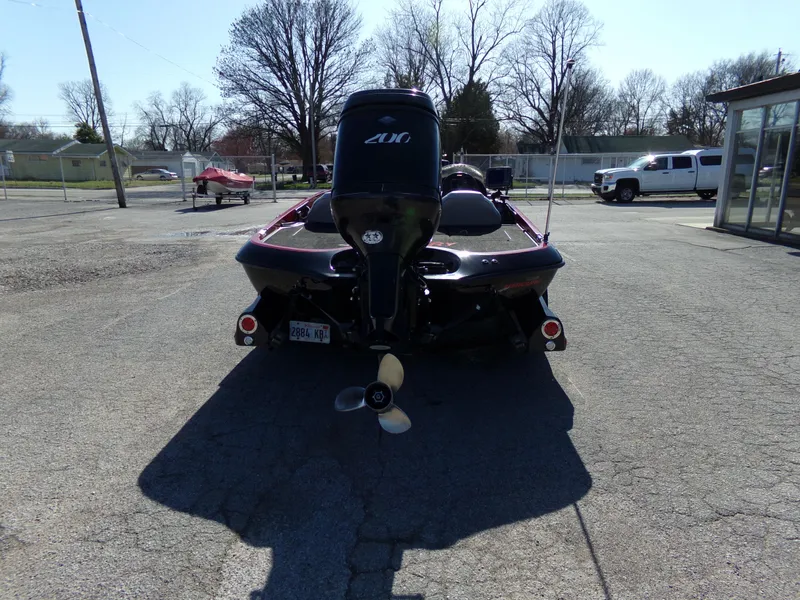 Slide: The Image of Rear view of a 2000 Ranger 518SVX Comanche boat with an outboard motor. - 8