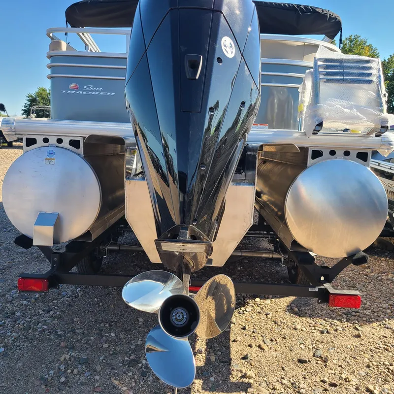 Slide: The Image of 2023 Sun Tracker Party Barge 22 RF XP3 pontoon boat rear view with outboard motor. - 2