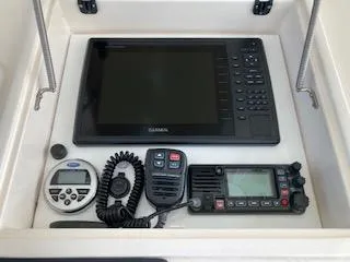 Slide: The Image of 2002 Intrepid 322 boat electronics: Garmin display, radio, and control panel. - 17