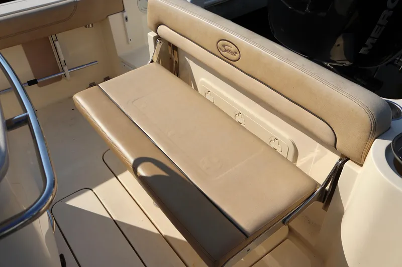 Slide: The Image of 2016 Scout 255 LXF boat with tan seating and stainless steel accents. - 14