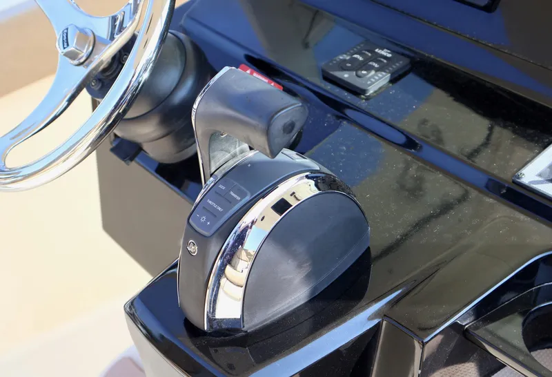 Slide: The Image of Close-up of 2016 Scout 255 LXF boat throttle and steering wheel. - 7