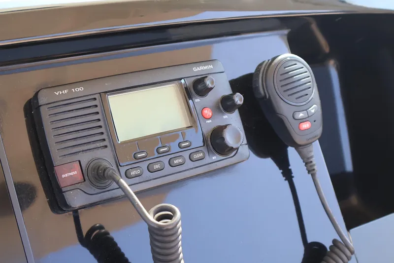 Slide: The Image of Garmin VHF 100 radio on 2016 Scout 255 LXF boat dashboard. - 8