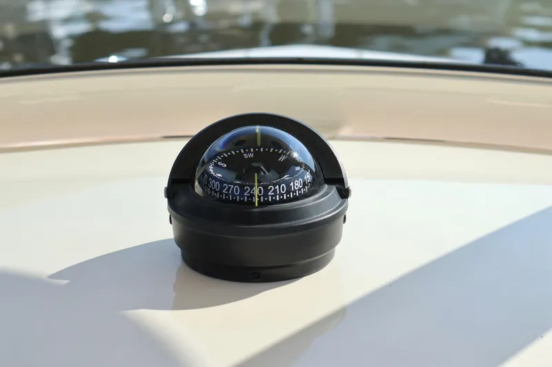 Slide: The Image of Compass on 2016 Scout 255 LXF boat dashboard, showing navigation details. - 9