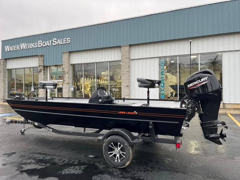 The Image of 2024 Lowe Legacy boat on trailer outside dealership. - 0