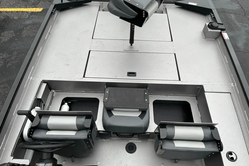 Slide: The Image of 2024 Lowe Legacy boat interior with seating and storage compartments. - 8