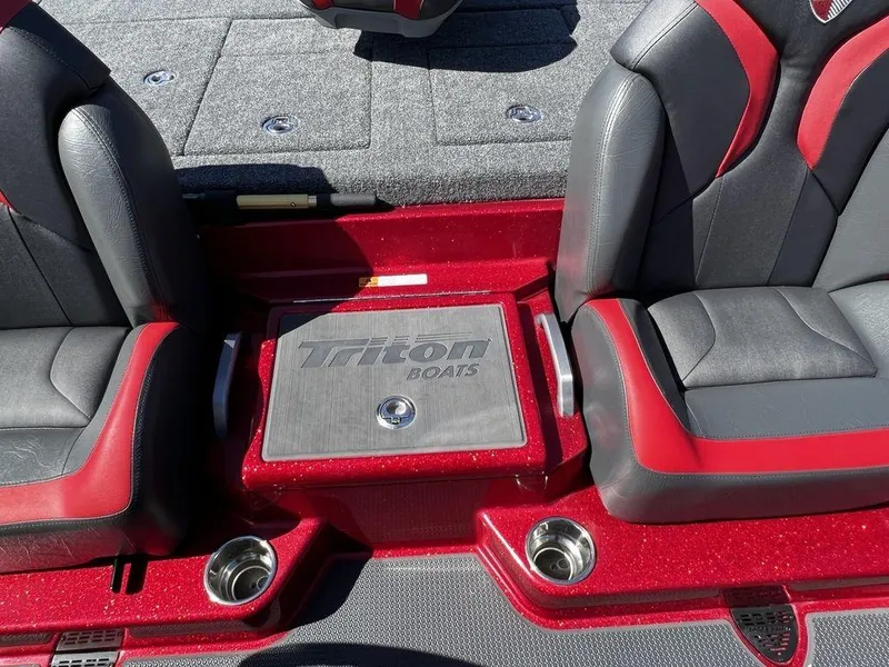 Slide: The Image of 2022 Triton 21 XrT boat interior with red and black seats. - 13
