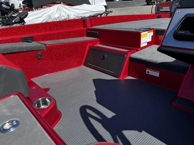 Slide: The Image of Interior of a 2022 Triton 21 XrT boat with red and gray detailing. - 15