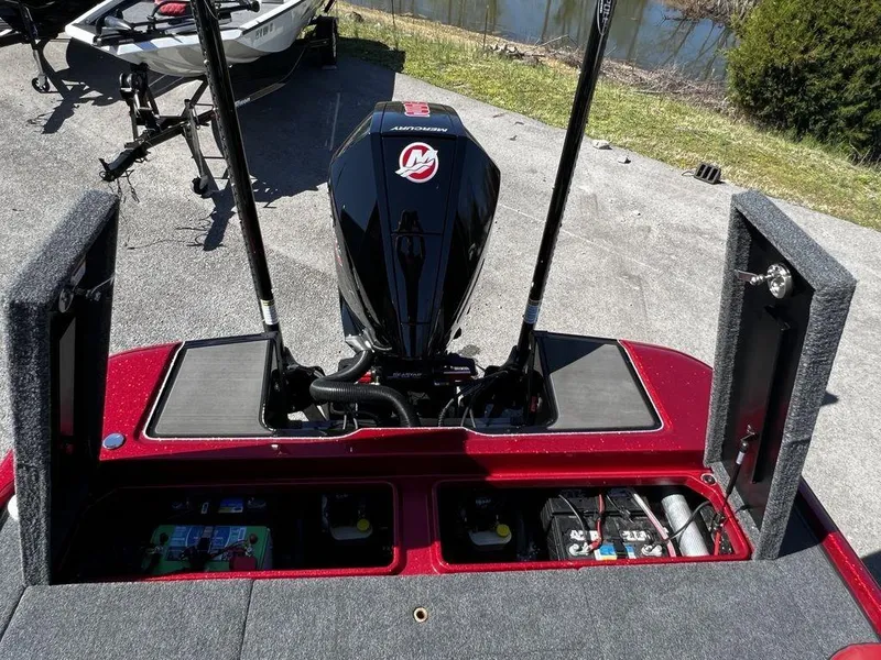 Slide: The Image of 2022 Triton 21 XrT boat with open compartments and Mercury engine. - 20