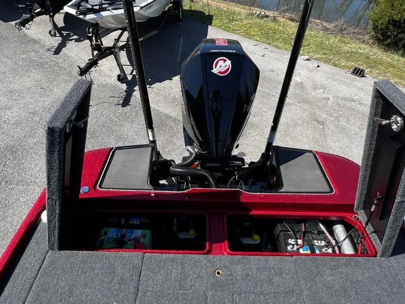 Slide: The Image of 2022 Triton 21 XrT boat engine and storage compartments. - 22