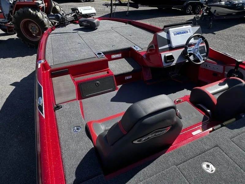 Slide: The Image of 2022 Triton 21 XrT boat interior with Lowrance electronics and seating. - 3