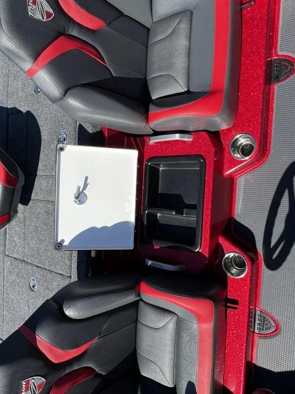 Slide: The Image of 2022 Triton 21 XrT boat interior with red and black seats. - 8