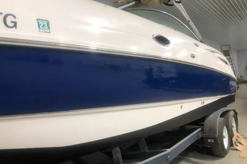 Slide: The Image of 2004 Chaparral 274 SUNESTA boat on trailer in indoor storage. - 11