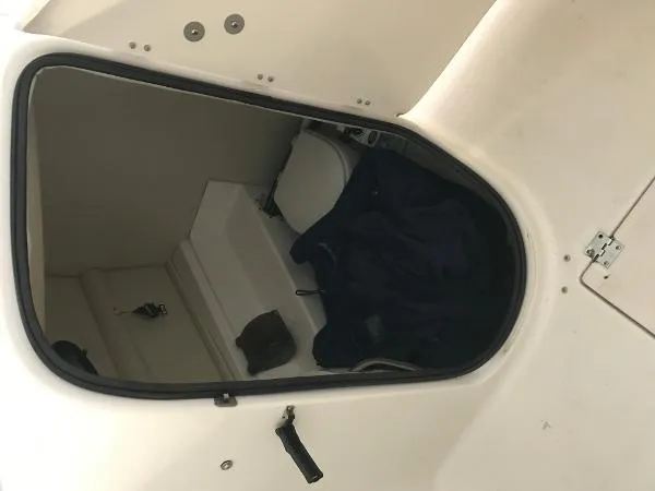 Slide: The Image of 2004 Chaparral 274 SUNESTA boat interior storage compartment with toilet. - 2