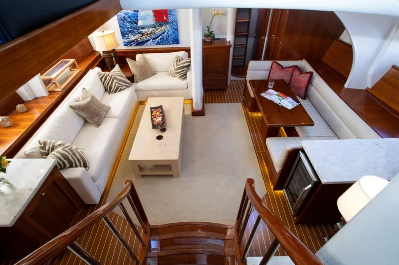 Slide: The Image of Luxurious interior of 1993 Able Custom 97' yacht with elegant seating and wooden finishes. - 10