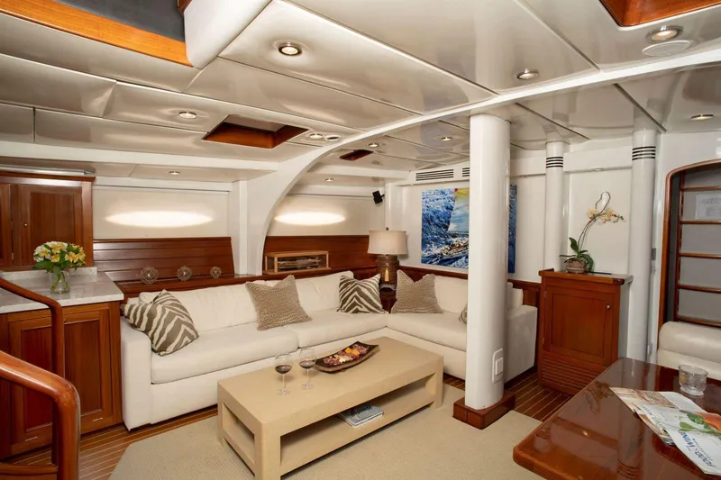 Slide: The Image of Luxurious yacht interior with white sofas, wooden accents, and modern decor, Able Custom 97', 1993. - 12
