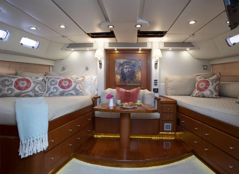 Slide: The Image of Luxurious cabin interior of a 1993 Able Custom 97' yacht with elegant decor and cozy seating. - 14