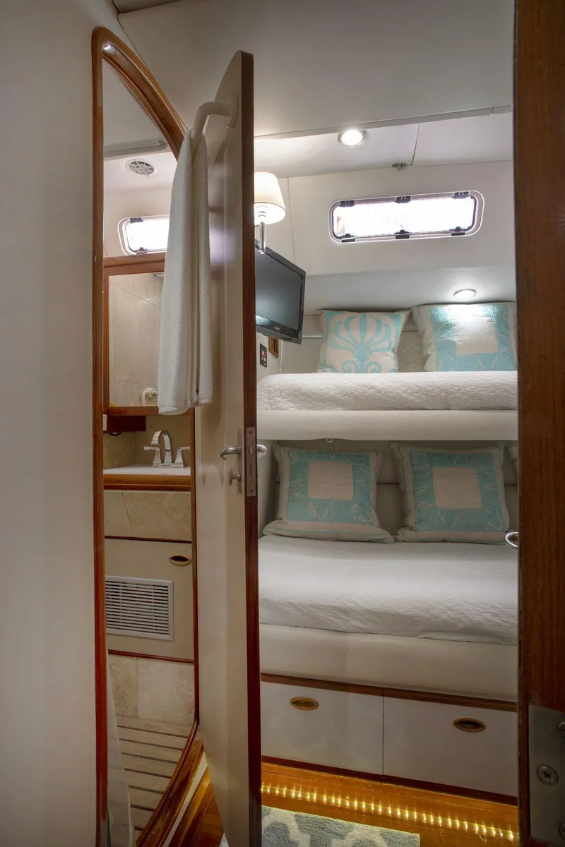 Slide: The Image of Cozy cabin interior of 1993 Able Custom 97' yacht with bunk beds and modern amenities. - 15