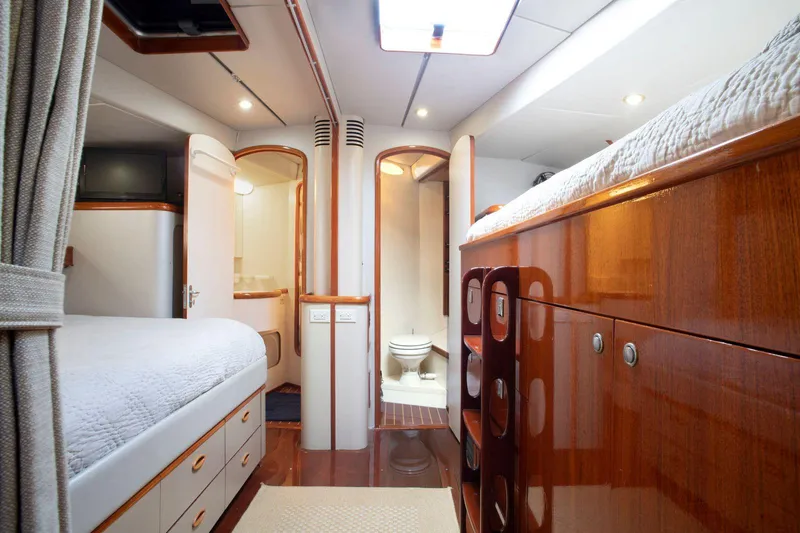 Slide: The Image of Luxurious interior of 1993 Able Custom 97' yacht with wood finishes and modern amenities. - 20
