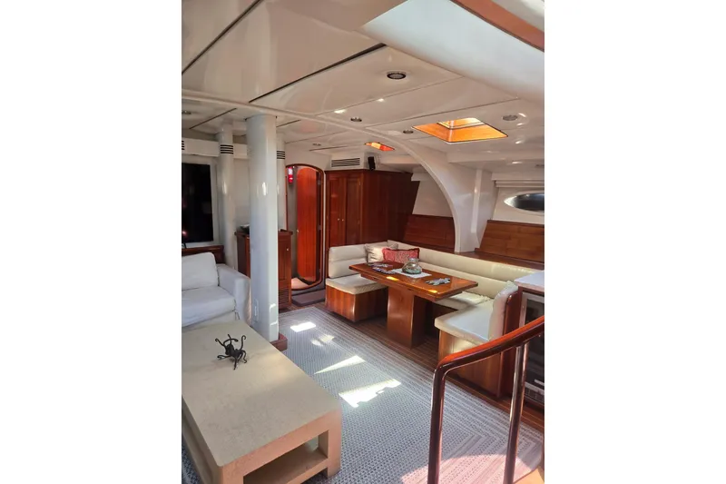 Slide: The Image of Luxurious interior of 1993 Able Custom 97' yacht with elegant seating and wooden finishes. - 30