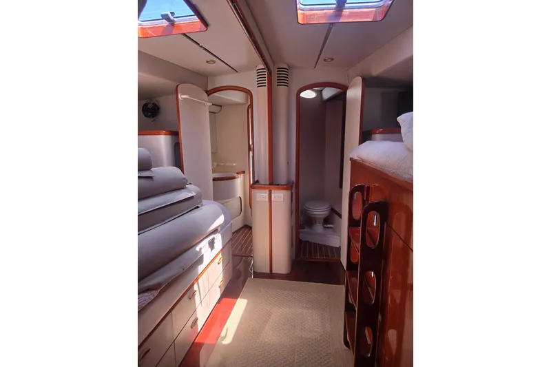 Slide: The Image of Luxurious interior of 1993 Able Custom 97' yacht with elegant wood finishes. - 32