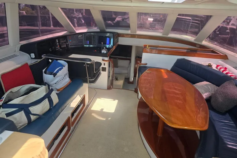 Slide: The Image of Interior of a 1993 Able Custom 97' yacht with seating and navigation equipment. - 36