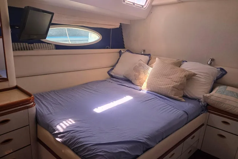 Slide: The Image of Cozy cabin interior of 1993 Able Custom 97' yacht with bed and TV. - 37