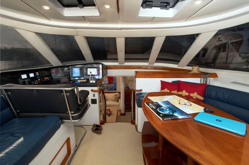 Slide: The Image of Interior of 1993 Able Custom 97' yacht with navigation station and seating area. - 7