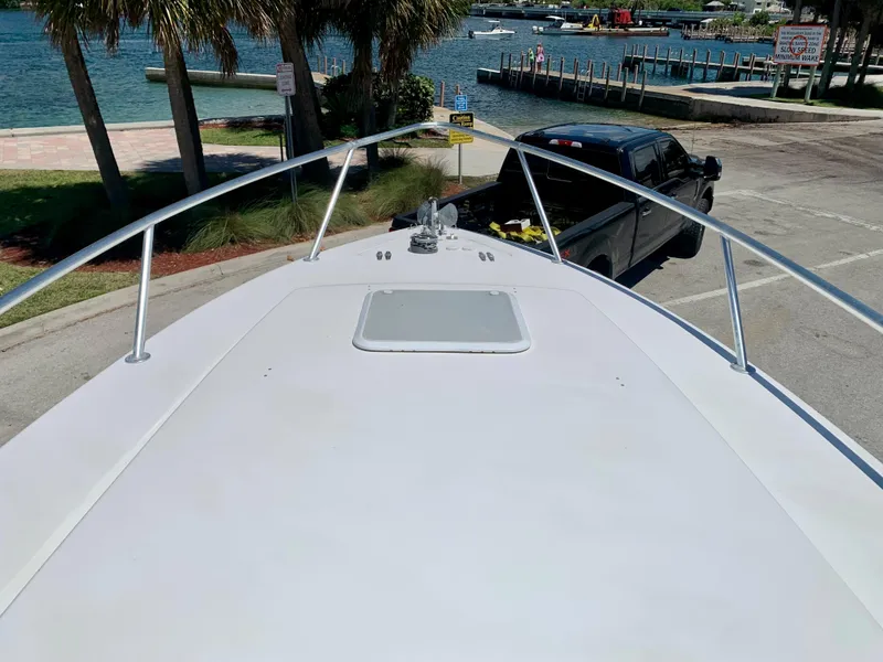 Slide: The Image of 2003 Contender 35 Express Side Console boat at dock, view from bow. - 11