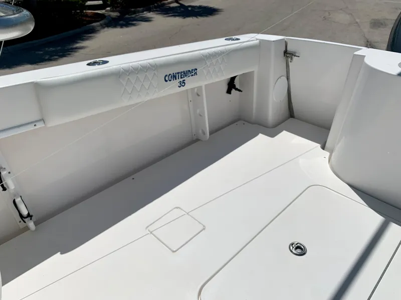 Slide: The Image of 2003 Contender 35 Express Side Console boat deck, clean and spacious. - 17