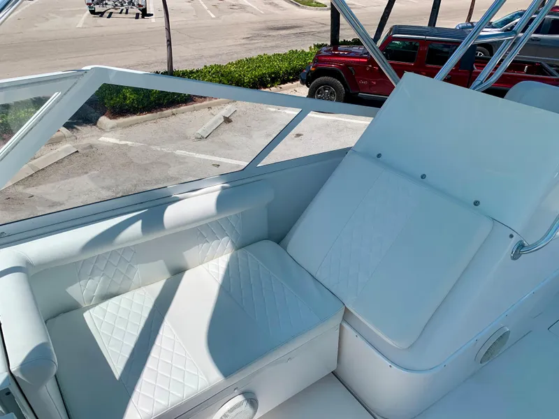 Slide: The Image of 2003 Contender 35 Express Side Console with white cushioned seating. - 18