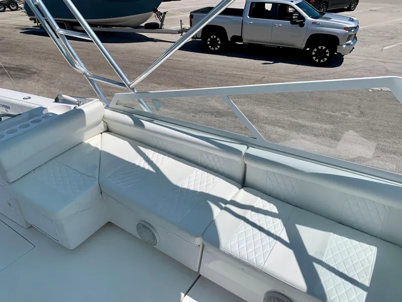 Slide: The Image of 2003 Contender 35 Express Side Console with white cushioned seating. - 19