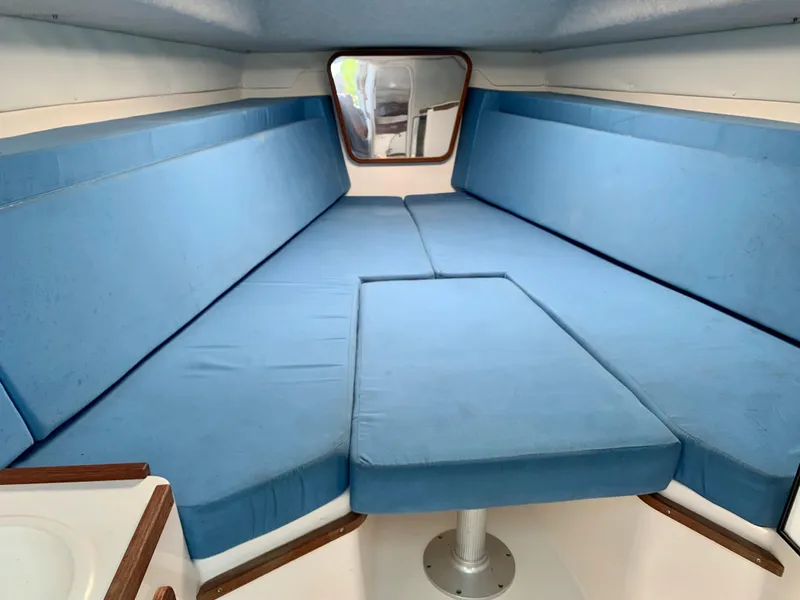 Slide: The Image of Interior cabin of 2003 Contender 35 Express Side Console with blue cushions. - 20