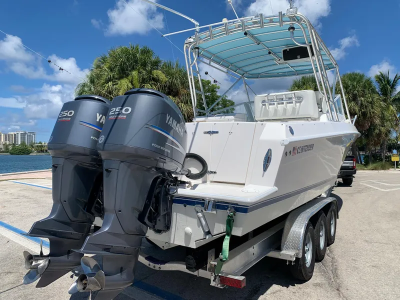 Slide: The Image of 2003 Contender 35 Express Side Console with twin Yamaha 250 outboard engines. - 24