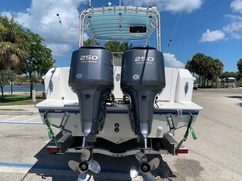 Slide: The Image of 2003 Contender 35 Express Side Console with twin 250 HP outboard motors. - 25