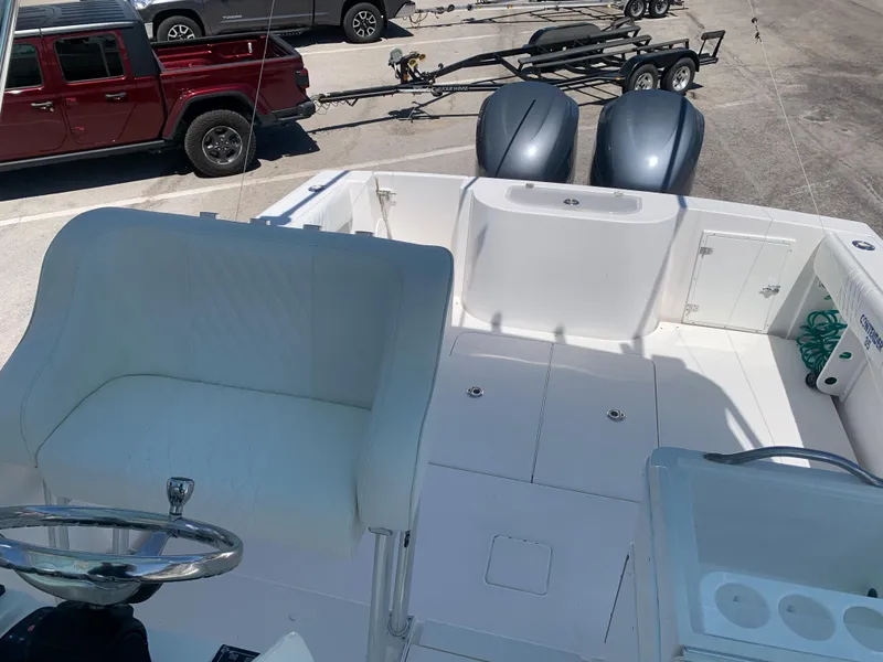 Slide: The Image of 2003 Contender 35 Express Side Console boat with dual outboard motors. - 33