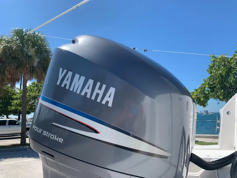 Slide: The Image of Yamaha four-stroke outboard motor on a 2003 Contender 35 Express Side Console boat. - 34