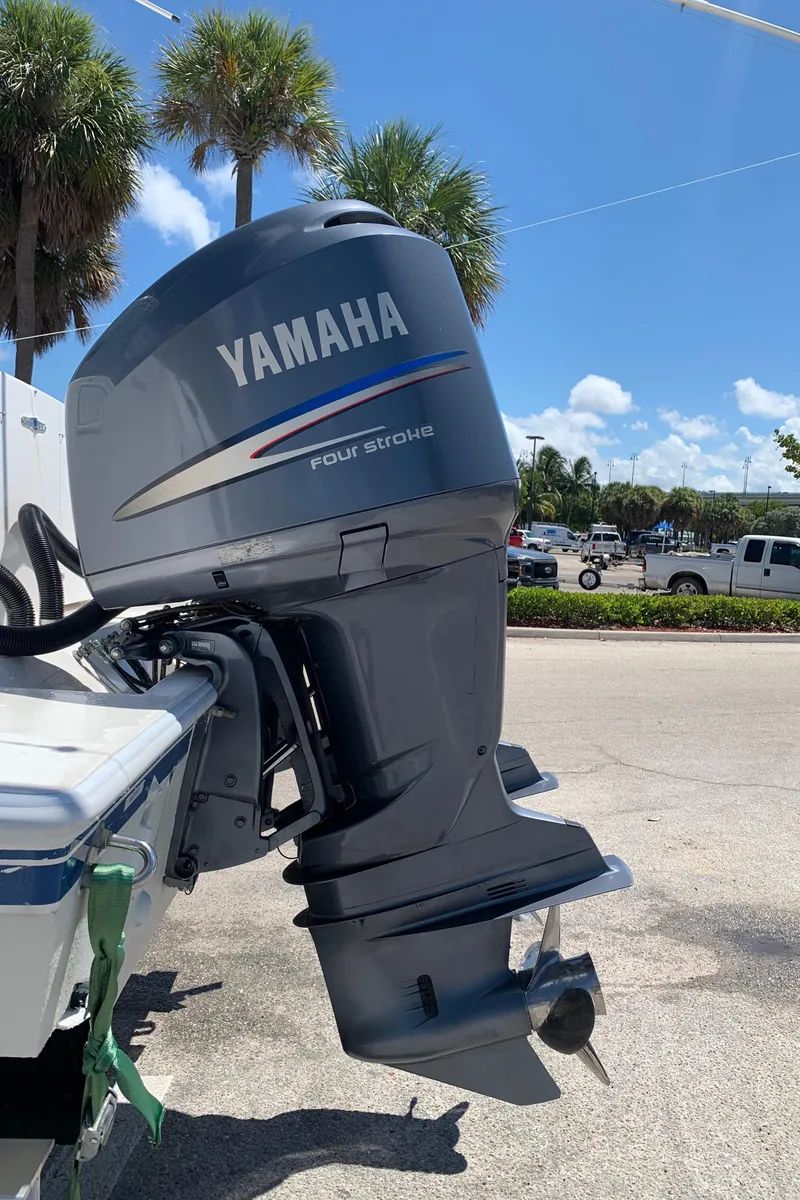 Slide: The Image of Yamaha four-stroke outboard motor on a 2003 Contender 35 Express Side Console boat. - 36