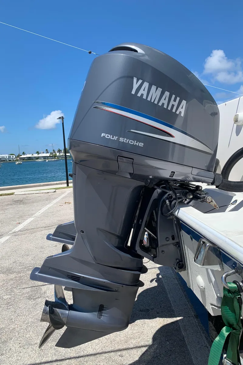 Slide: The Image of Yamaha four-stroke outboard motor on a 2003 Contender 35 Express Side Console boat. - 37