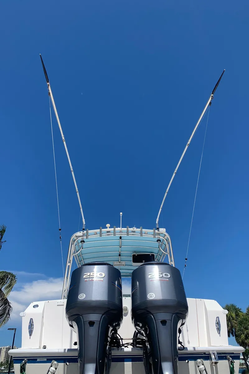 Slide: The Image of 2003 Contender 35 Express Side Console with twin 250 HP outboard motors. - 38