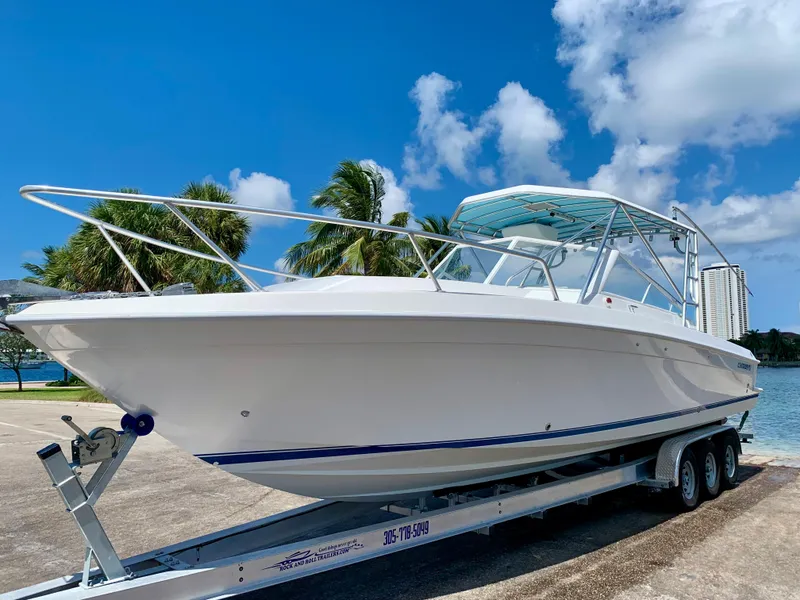 Slide: The Image of 2003 Contender 35 Express Side Console boat on a trailer, ready for launch. - 5
