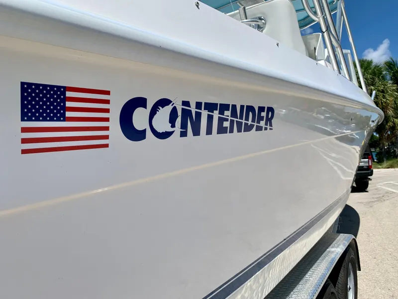 Slide: The Image of 2003 Contender 35 Express Side Console boat with American flag decal. - 7