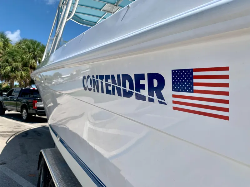 Slide: The Image of 2003 Contender 35 Express Side Console boat with American flag decal. - 8
