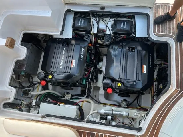 Slide: The Image of 2014 Four Winns 355V engine compartment with dual Volvo Penta engines. - 15