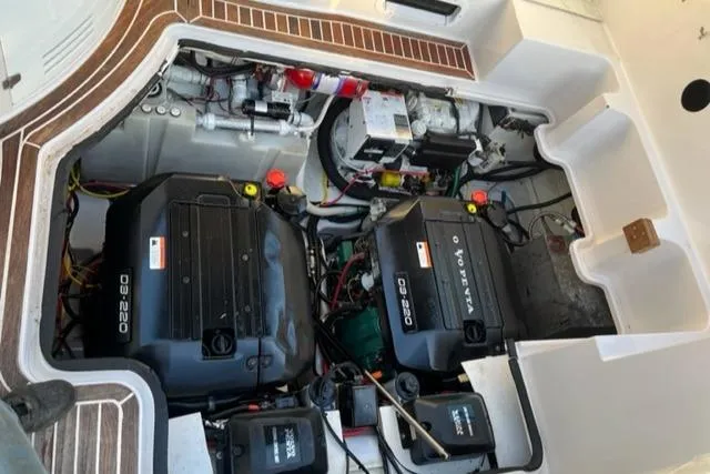 Slide: The Image of Engine compartment of a 2014 Four Winns 355V boat showing dual engines and components. - 16