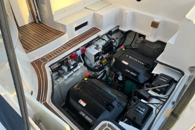 Slide: The Image of 2014 Four Winns 355V boat engine compartment with twin Volvo Penta D3-220 engines. - 17