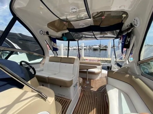 Slide: The Image of Interior of 2014 Four Winns 355V boat with dock and water view. - 33