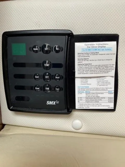 Slide: The Image of 2014 Four Winns 355V SMXir control panel with operation instructions. - 43