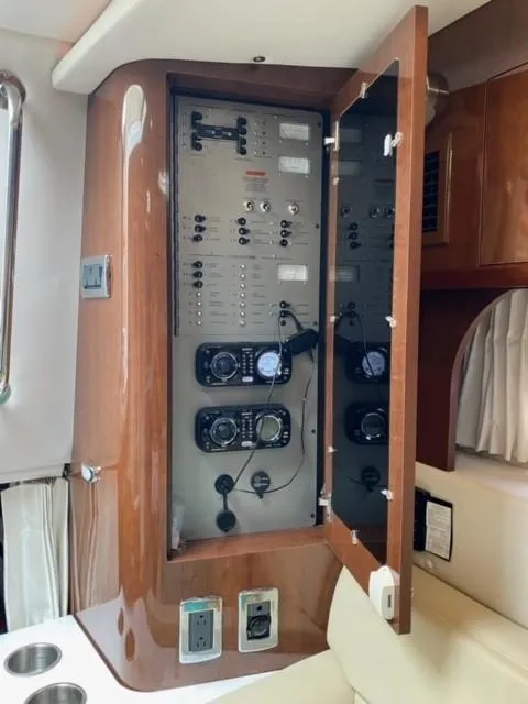 Slide: The Image of Electrical control panel inside a 2014 Four Winns 355V boat. - 44